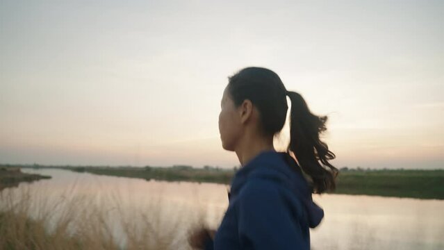 Asian woman are workout outdoor and running in morning or evening at park