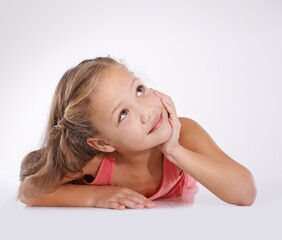 Thinking, kid and girl with ideas or decision and contemplation on white studio background. Model,...
