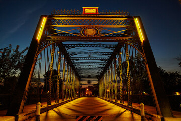 Warmly Lit Historical Iron Bridge at Twilight, Fort Wayne