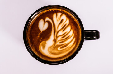 Close up top view cup of latte art coffee on white background