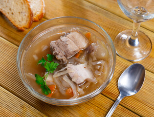 Delicious traditional shchi soup with beef and sauerkraut served in bowl