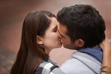 Naklejka premium Love, city and face of couple kiss, bonding together and enjoy outdoor date with care, support and partner commitment. Devotion, relationship connection and romantic people in sweet intimate moment