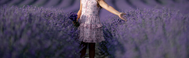 Lavender field girl. happy girl in pink dress in a lilac field of lavender. Aromatherapy concept,...