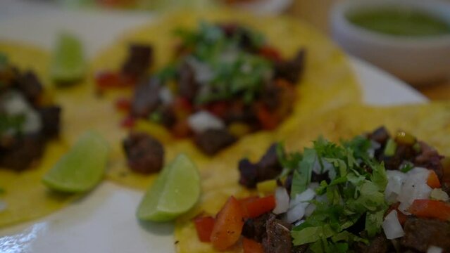 Soft corn tortilla carnitas spicy pork taco with fresh onion cilantro lime and salsa Mexican food