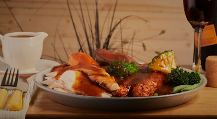 Roast chicken dinner with a rich gravy.