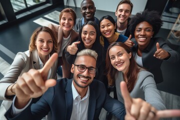 group of professional work friends taking a picture at modern workplace 