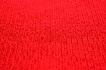 texture of red wool knitted yarn, woolen fabric background