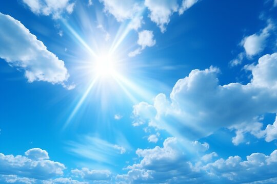Blue sky background with tiny clouds and bright sun,