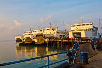 Many Cruise  Ships and fishing boats docked at the Koh Samui harbor pier.