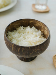 Jasmine rice in a bowl made from natural materials