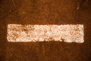 red clay baseball field and various views of the baseball home plate