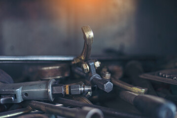 Mechanic tools engineering equipment car auto repair shop with copy space. Blurred background mechanical service. Heavy screw grungy rusted wrenches dirty screwdriver object. Industrial hardware set