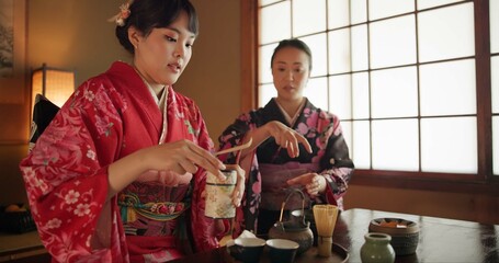 Culture, teapot and Japanese women with tea in home with traditional herbs, leaves and flavor in...