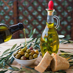 olive oil, extra virgin olive oil in a glass bottle, on a wooden table.