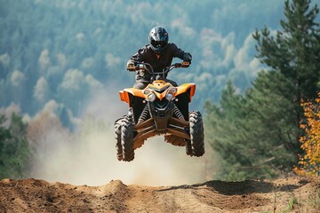 A man jumps with a quad bike on the track.