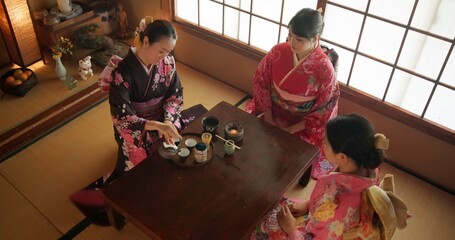 Japanese, women and kimono for tea ceremony in Chashitsu with matcha or custom tradition. People,...