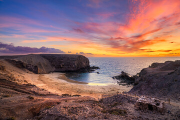 Beautiful sunset over Playa the Papagayo beach on Lanzarote island - Canaries - Spain - obrazy, fototapety, plakaty