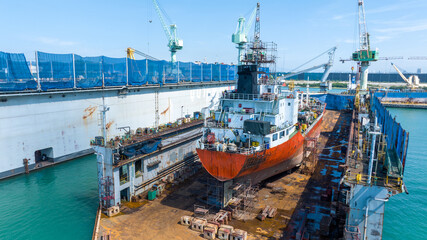 Oil tanker ship at dry dock concept maintenance service. working at dry dock. Insurance and Maintenance Crude tanker Ship concept. Freight Forwarding Service maintenance Insurance. - obrazy, fototapety, plakaty