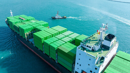 Green Cargo Container Ship, Cargo Container only green color. container ship running in the ocean to shipyard sea port. import shipping freight logistics. Concept green transportation environment
