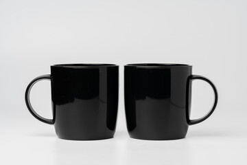 Black coffee mugs mock up on white background copy space