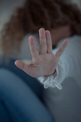 Violence on women concept at home - close up of woman hands to protect her - crime violented man and house danger situation for females - husband and wife crimes