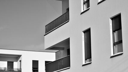 Fragment of the building's facade with windows and balconies. Modern apartment buildings on a sunny...