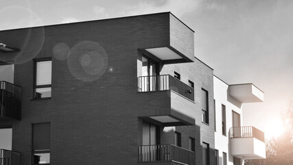 Fragment of the building's facade with windows and balconies. Modern apartment buildings on a sunny...