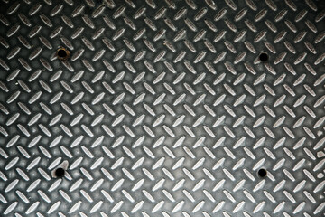 Weathered iron wall with seamless background of iron products