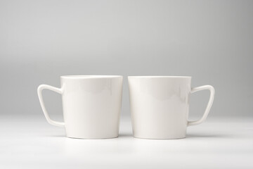 Blank white mugs mock up on white background