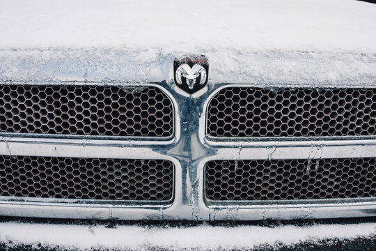snow-covered grill of Dodge Ram truck