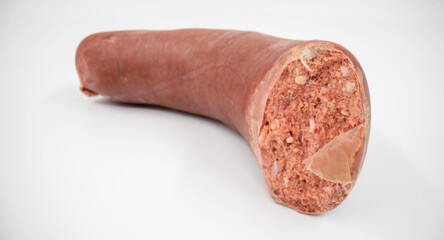 Cut sausage close up isolated.