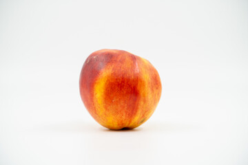Peach nectarine close up on white background isolated.