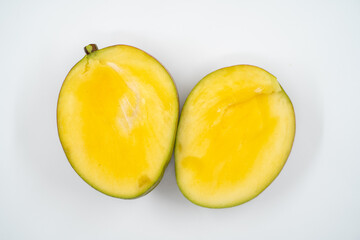 Naklejka na ściany i meble Cut mango close up on white background isolated.