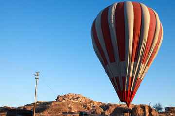 Fototapeta na wymiar Hot air balloons flying against the blue cloudless sky