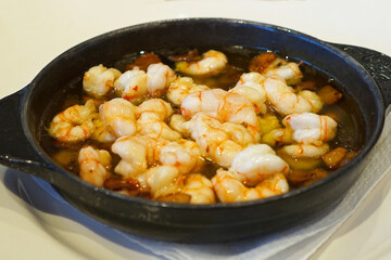 Close up Gambas al Ajillo, Spanish Garlic Shrimp with olive oil and dried chili- Classic Tapas	
