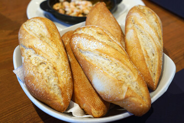 Close up bowl of short baguette loaf