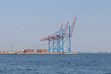 Port cargo crane and container ship in harbor of Odesa, Ukraine