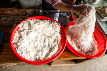 Vietnamese rice noodles for Pho preparation in street food stall