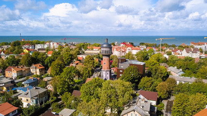 Russia, Zelenogradsk - September 22, 2018: Water tower Krantz. The city water tower was built in Kranz in 1904. Tower height is 40 m. Murarium, From Drone - obrazy, fototapety, plakaty