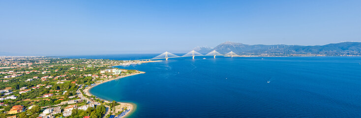 Rion, Greece. Rion - Andirion. Cable-stayed automobile-pedestrian bridge across the Gulf of Corinth. Summer day. Aerial view