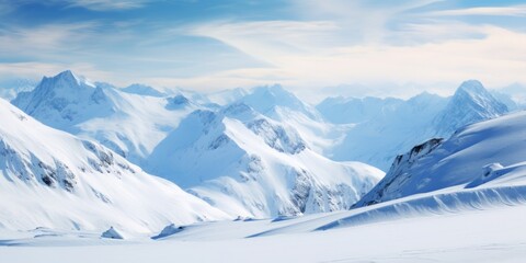 Obraz premium Snow mountain landscape against the blue sky with clouds.