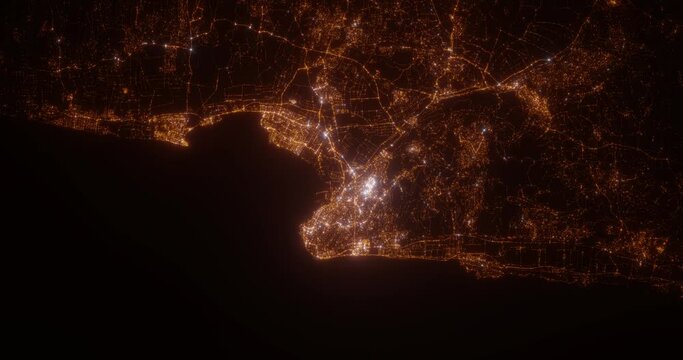 Haifa (Israel) top view at night. View on modern city from satellite. Camera is zooming in, rotating counterclockwise. Vertical video. The north is on the left side