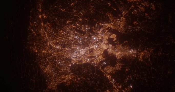 Nairobi (Kenya) aerial view at night. Top view on modern city with street lights. Camera is flying above the city, moving backward