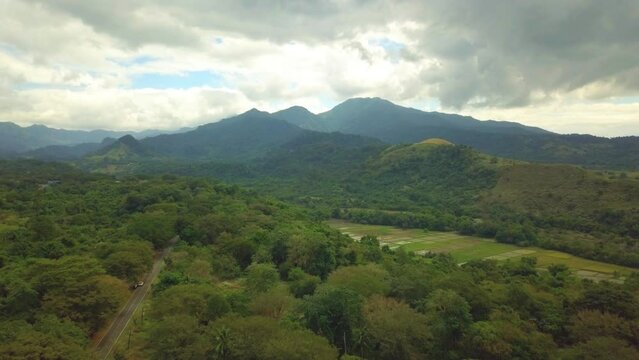 Scenic Aerial Drone Video of the Mount Natib, Rice fields and the Bataan National Park in Morong, Bataan, Luzon, Philippines