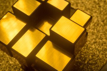 Golden metal elements against a radiant background