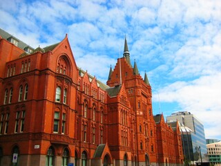 De Vere Holborn Bars, red brick building, under the blue sky in London, UK
