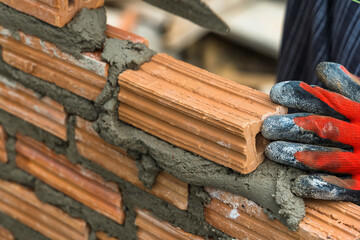 Hand worker masonry brickwork trowel construction site wall concrete background - 720050904