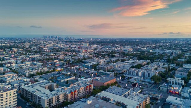 Aerial hyperlapse of Hollywood skyline, revealing city of Los Angeles cityscape at sunset.