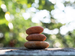 Obraz na płótnie Canvas Stone Zen Stack Balance Abstract blur Leaf Background Stability Spa Pyramid Pebble Group Peace Overlay Sunshine nature, Meditation Natural Harmony Aroma Outdoor Relaxtion Massage Japan Health Word.