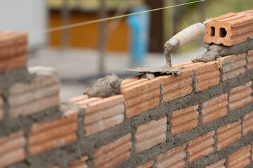 brick block structure construction plaster cement mortar wall in residential building industry - obrazy, fototapety, plakaty